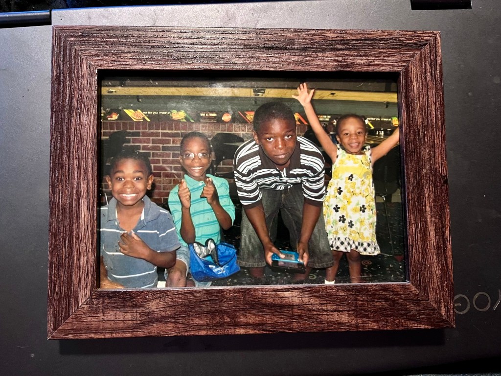 picture of four black siblings