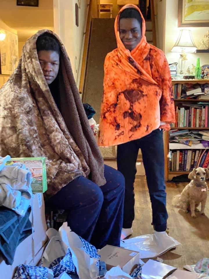 Two teenagers wrapped in blankets