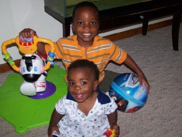 Two little boys smiling for the camera