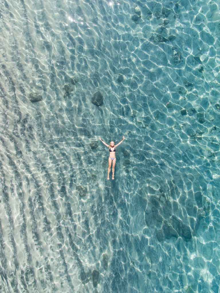 Woman floating in a lake